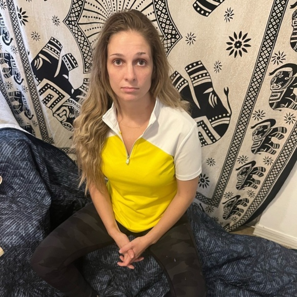 Yellow and white athletic golf tee